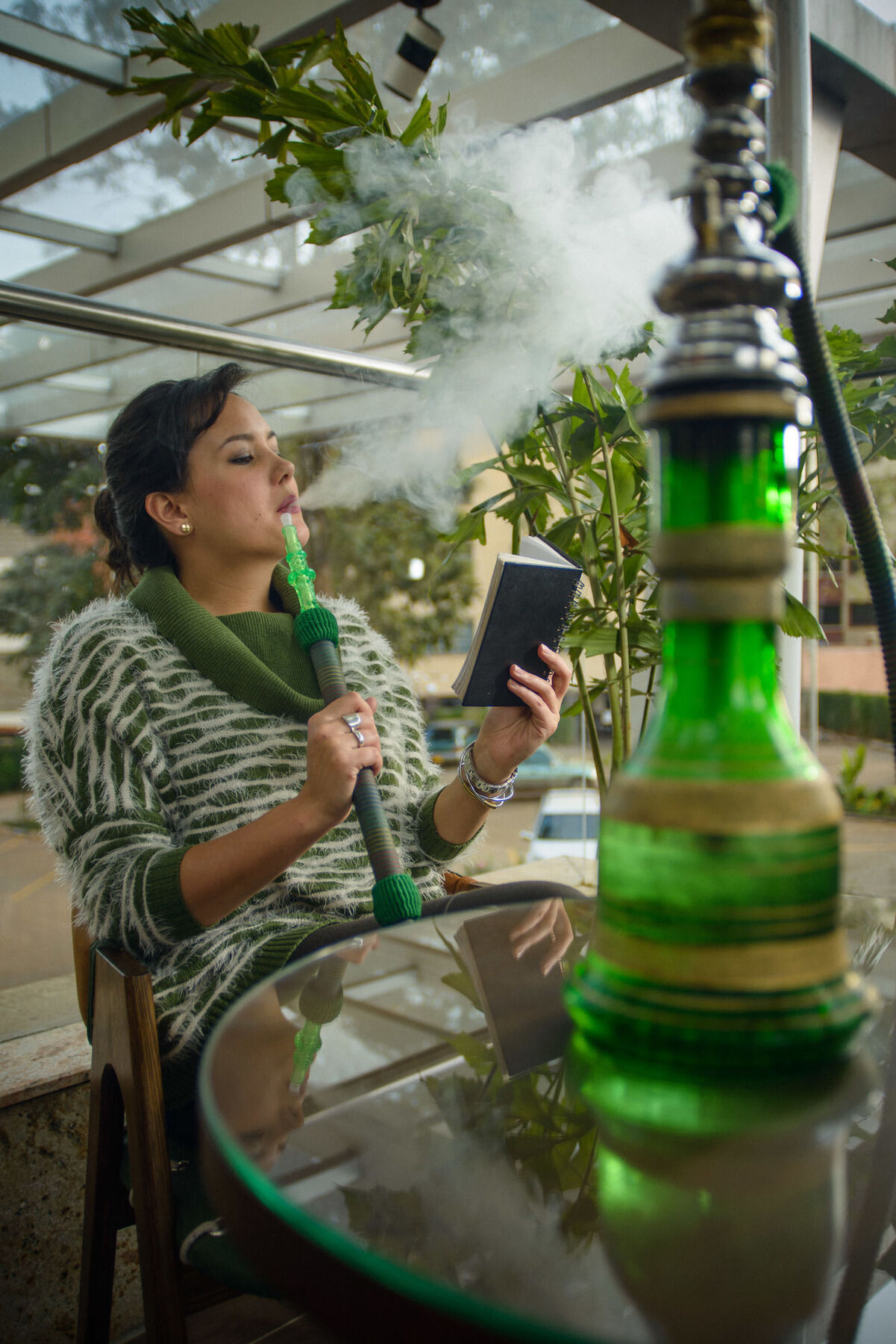 The Concord Hotel & Suites Nairobi Zewnętrze zdjęcie A woman smoking a hookah